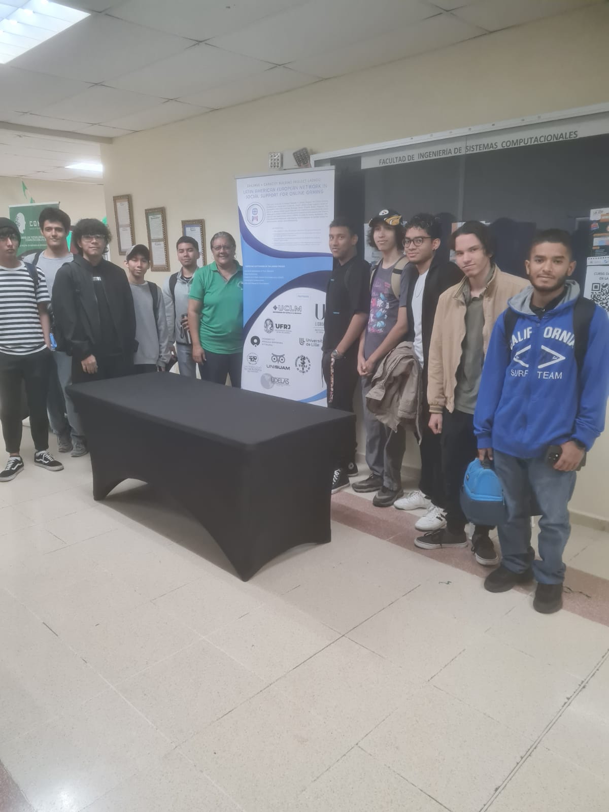 Prof. Denis Cedeño and Software Management and Development students at the poster presentation.